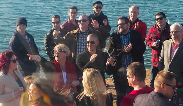 Group of Affboost Media employees standing on pier
