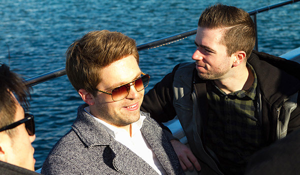 3 guys on deck of yacht