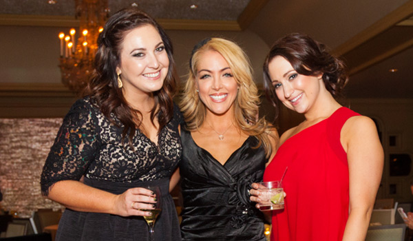 3 woman at Christmas party posing for camera